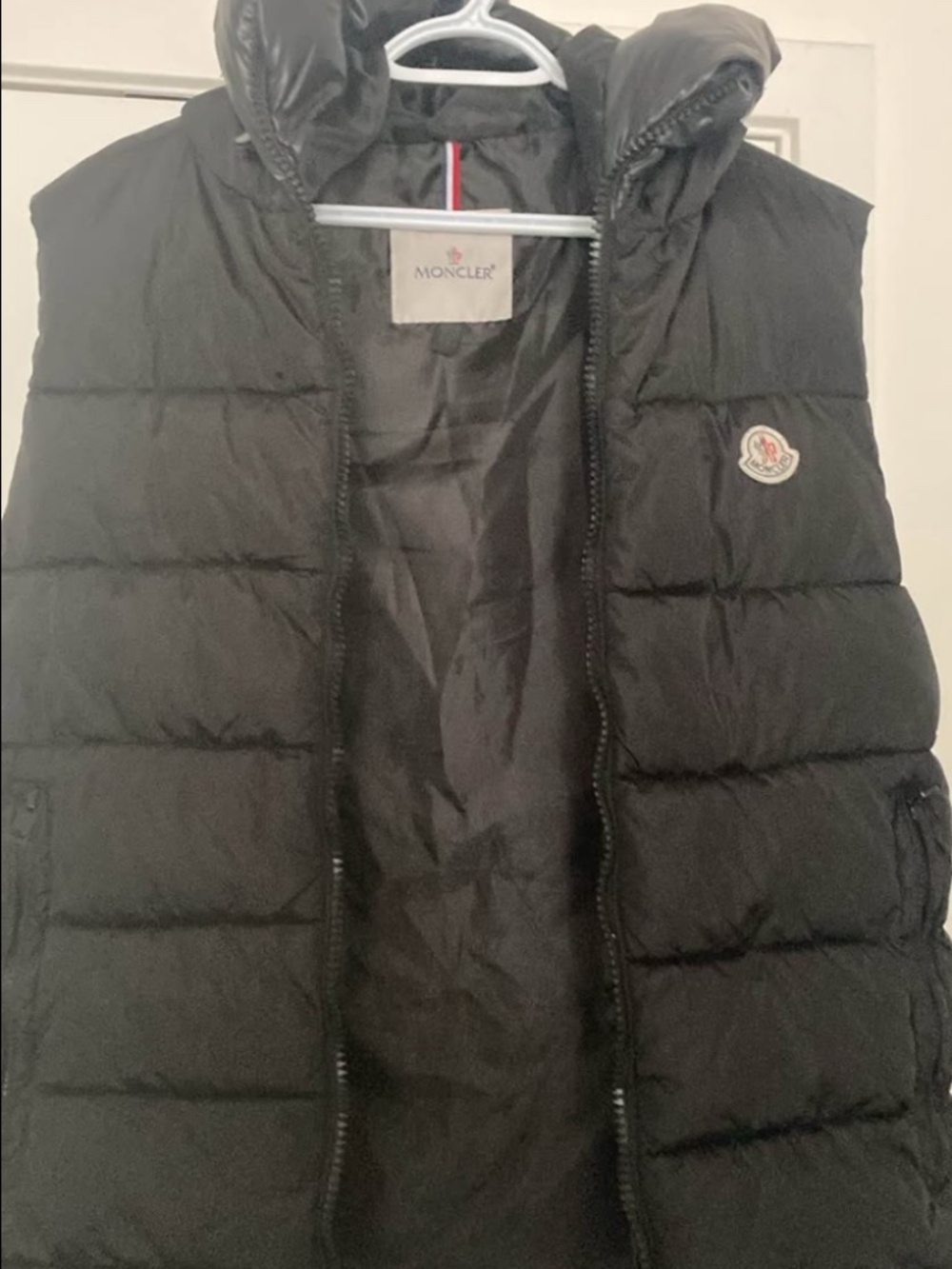 Black Moncler down vest with hood